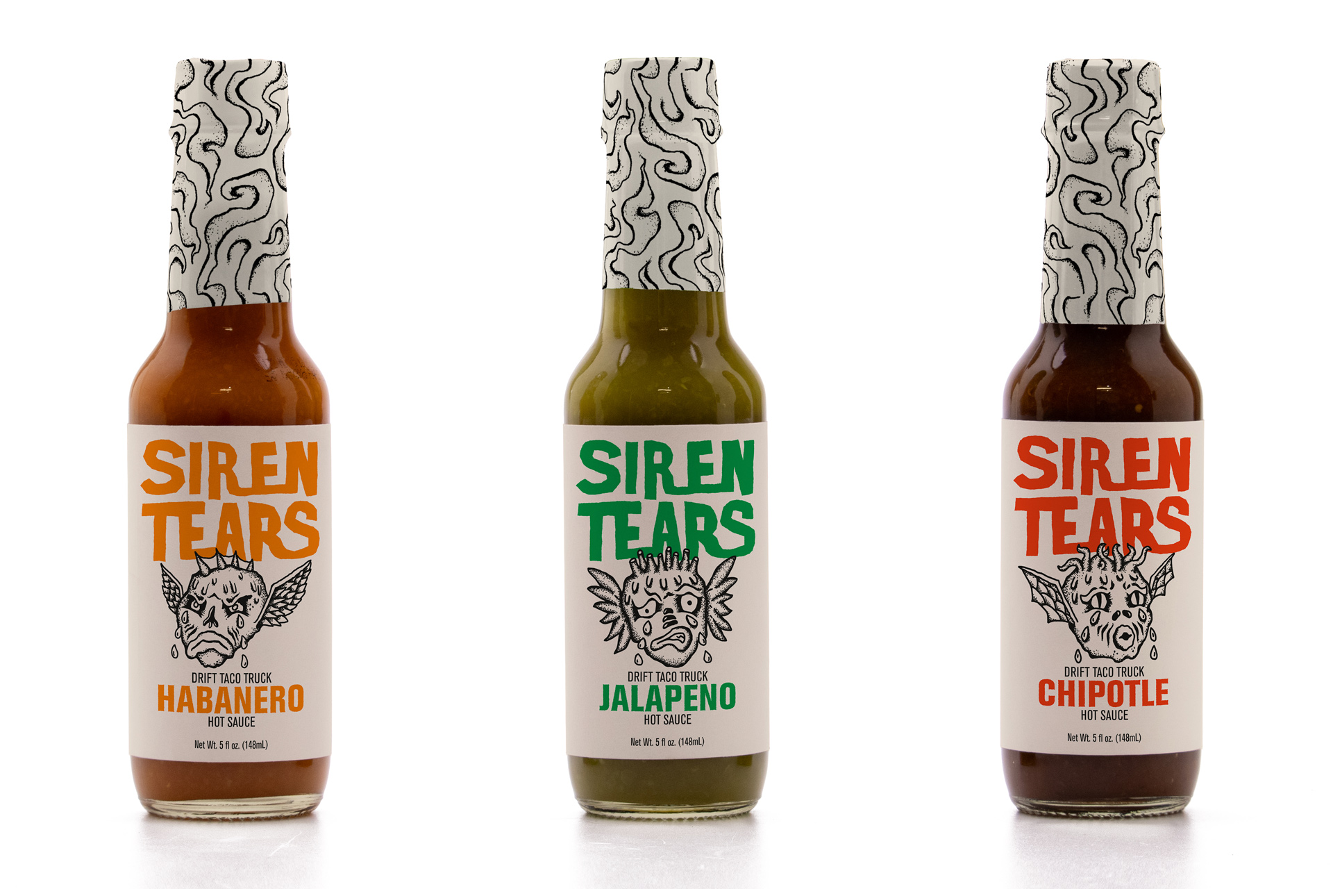 Three hot sauce bottles with the siren tears branding.